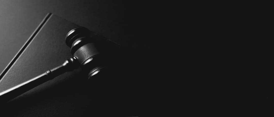 A judge's gavel and law books – background for Moly IPTV's guide to whether IPTV is legal